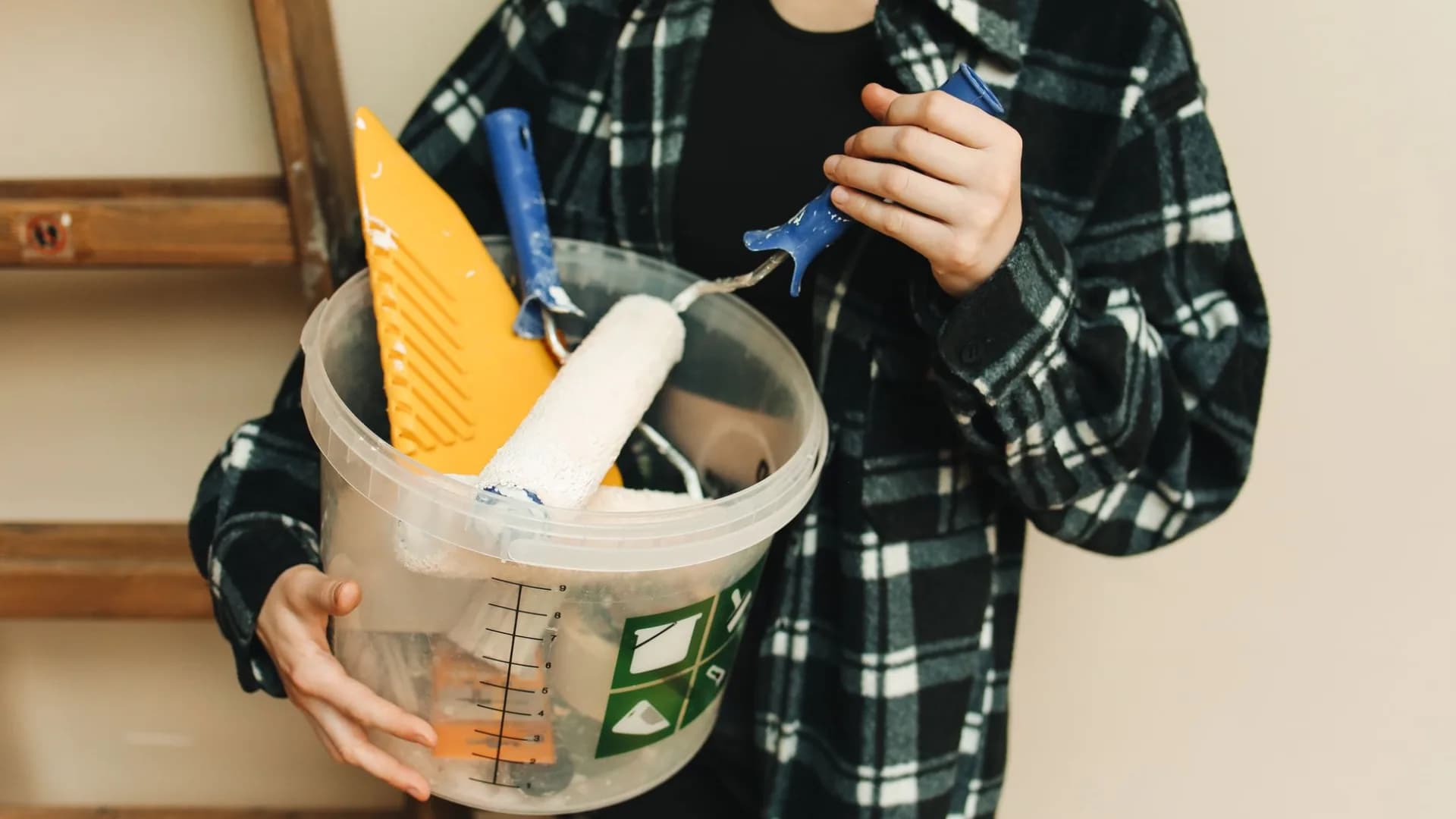 Person cleaning a renovated kitchen