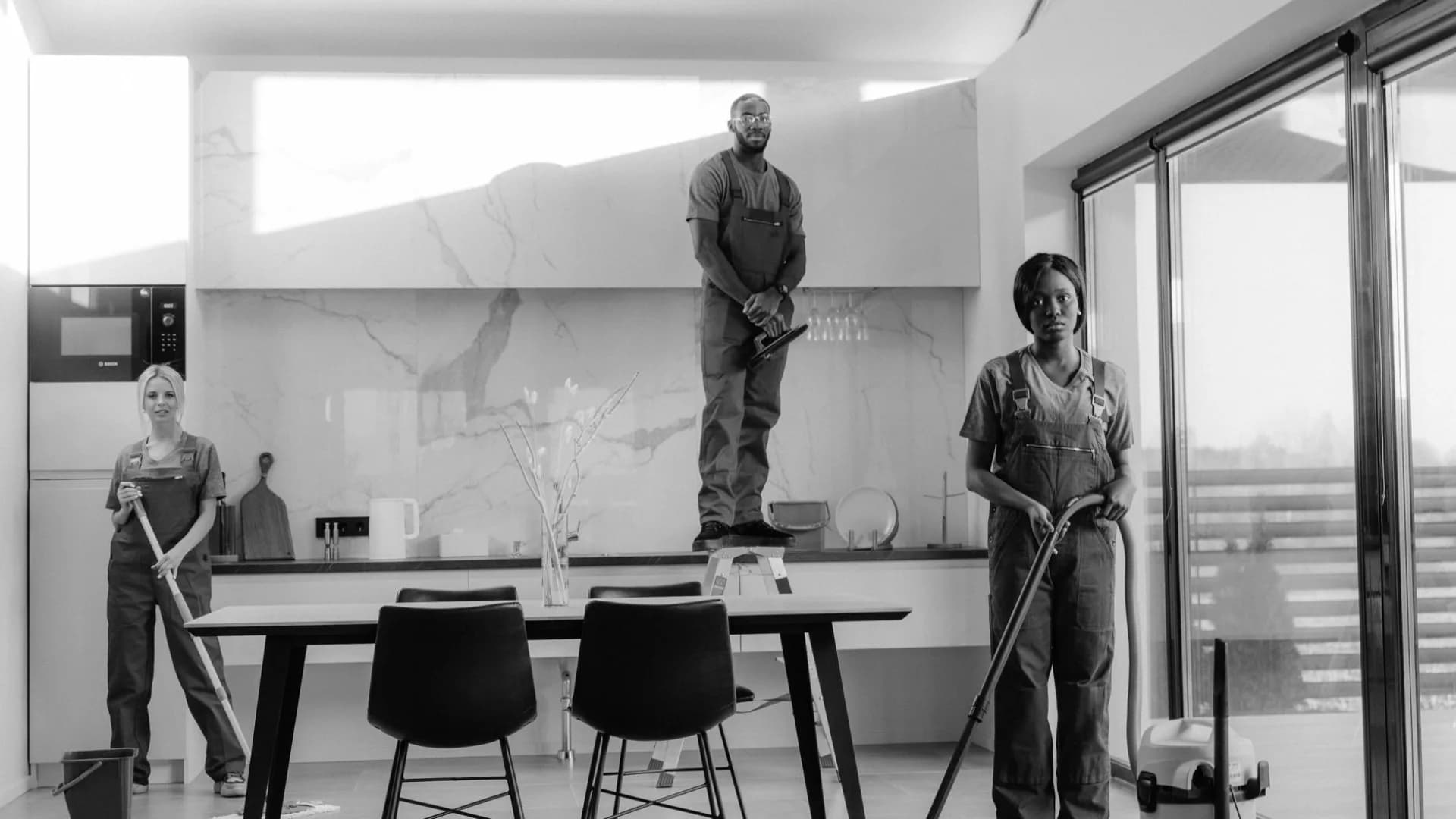 Professional cleaner in a renovated kitchen