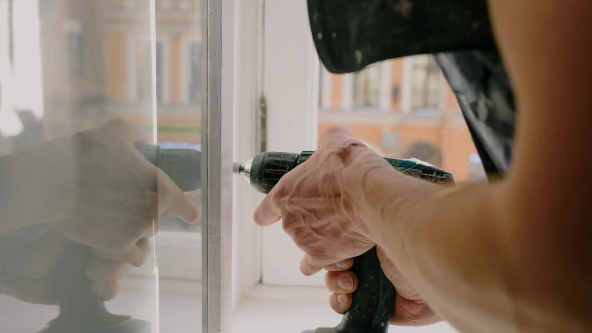 A handyman working on multiple home repairs.