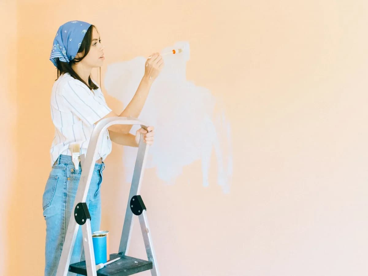 Professional painter working in a living room