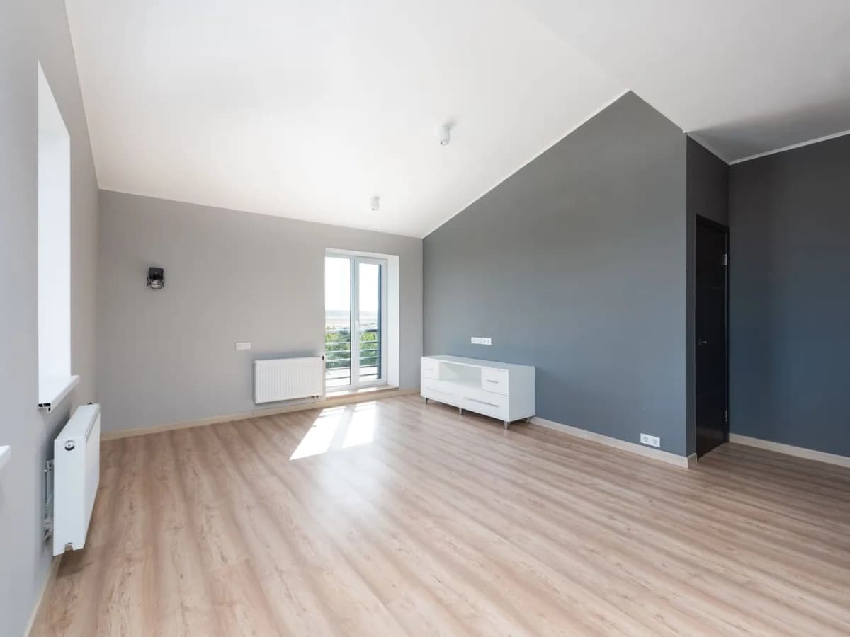 Finished drywall repair in a well-lit living room