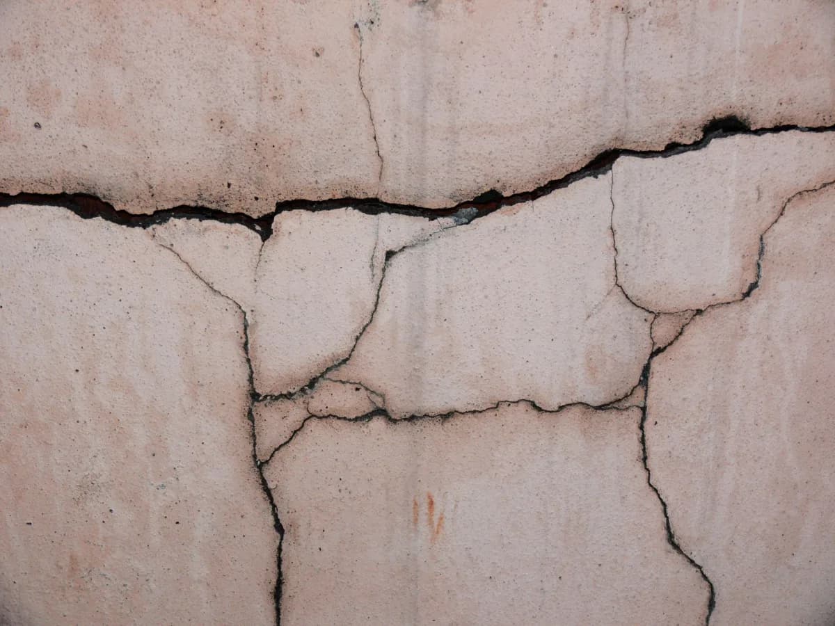 Close-up of cracked drywall showing damage