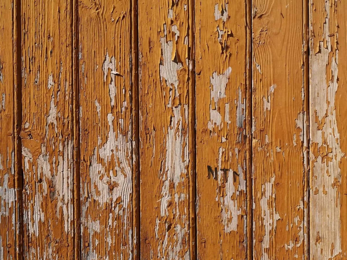 Warped wooden fence panel