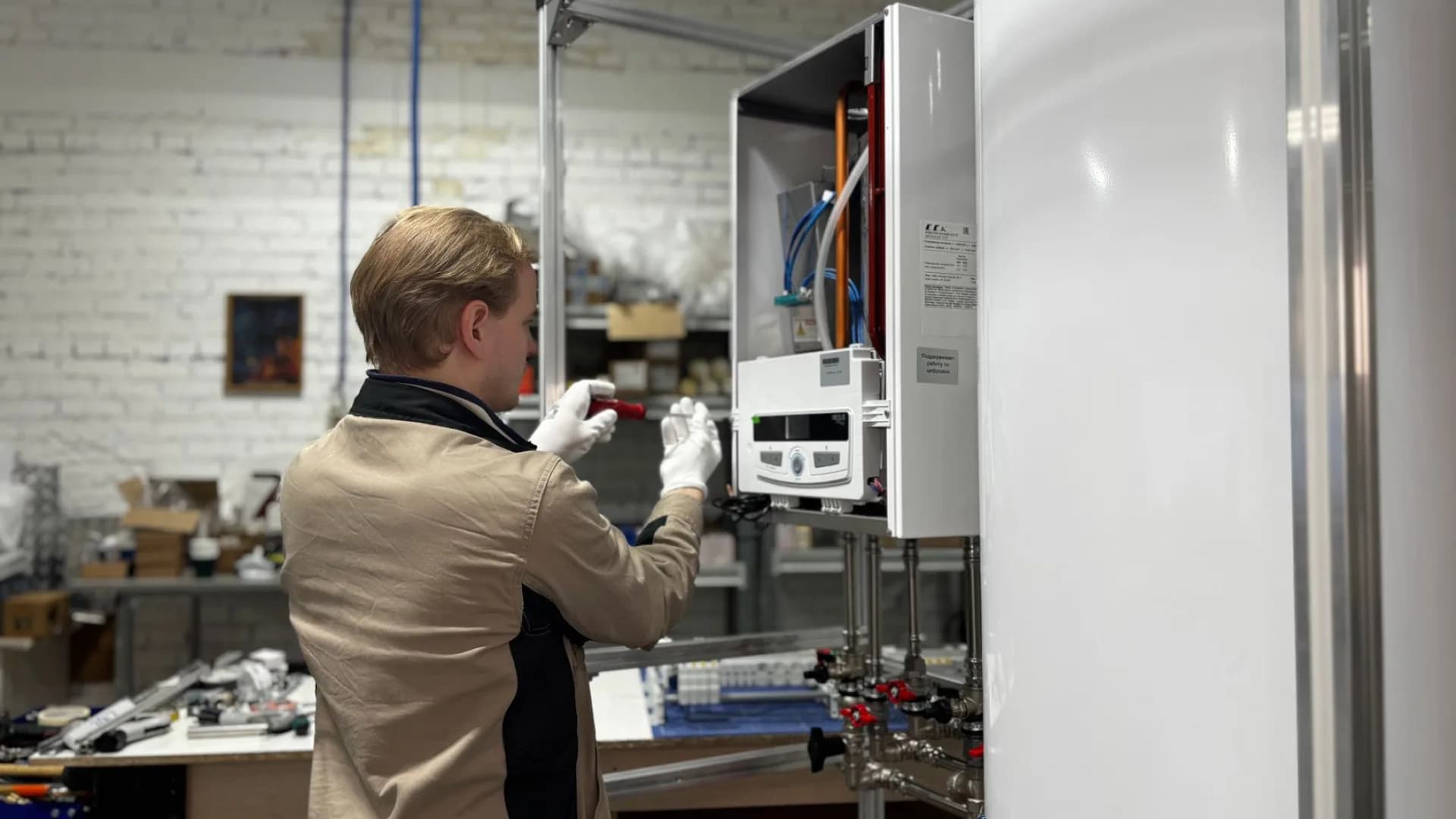 HVAC technician examining a system in a home