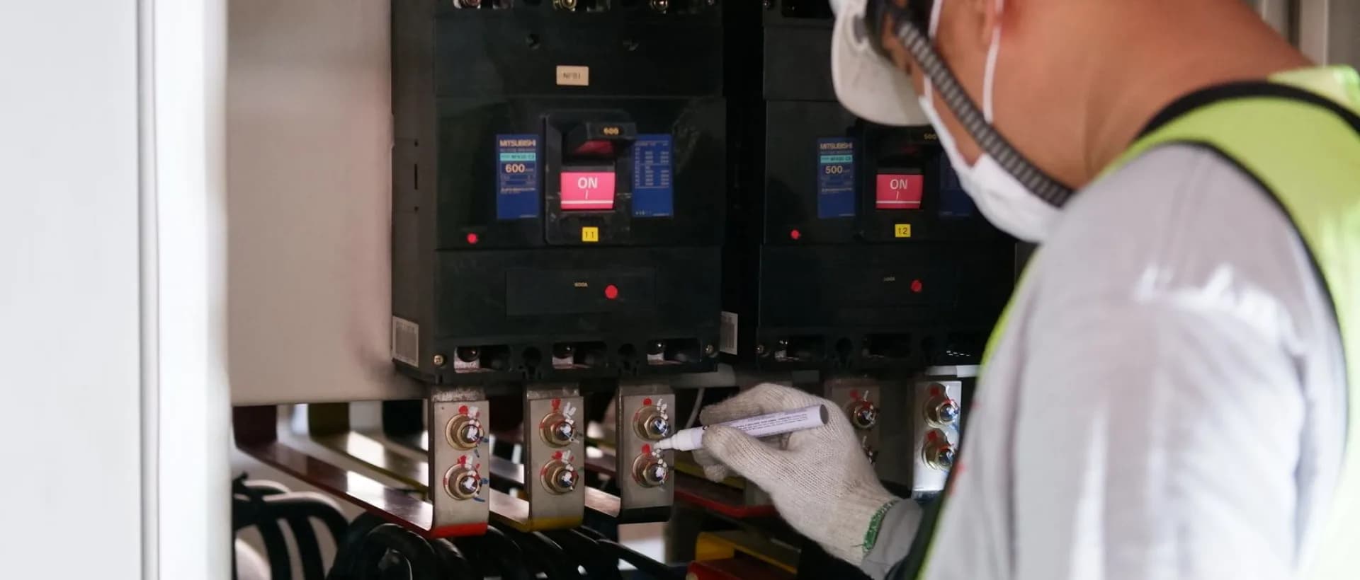 Technician inspecting a bathroom fan