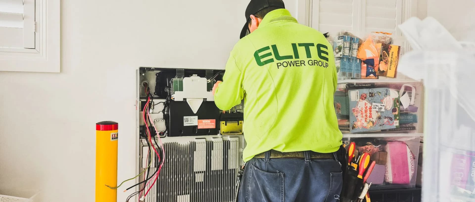 Technician installing bathroom fan