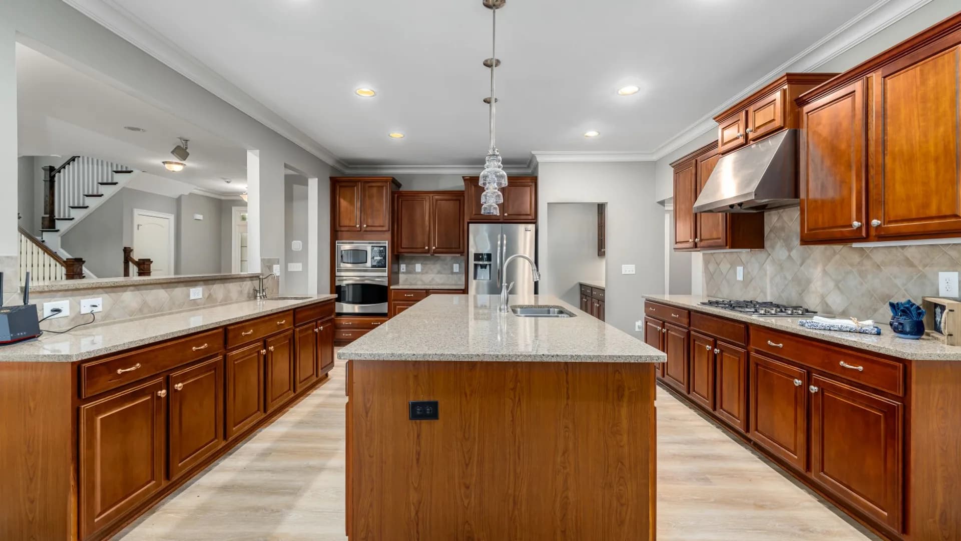 Homeowner inspecting range hood