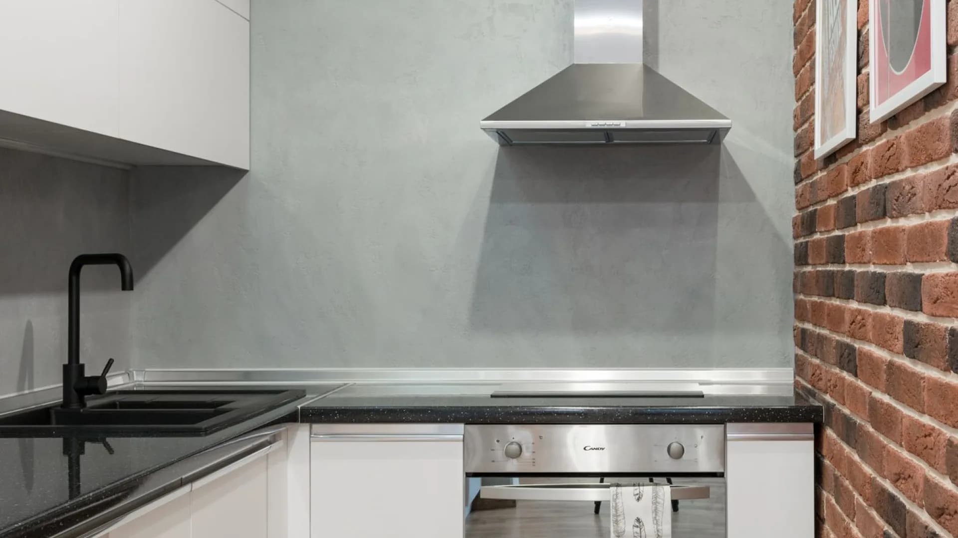 Range hood installation in progress in a modern kitchen
