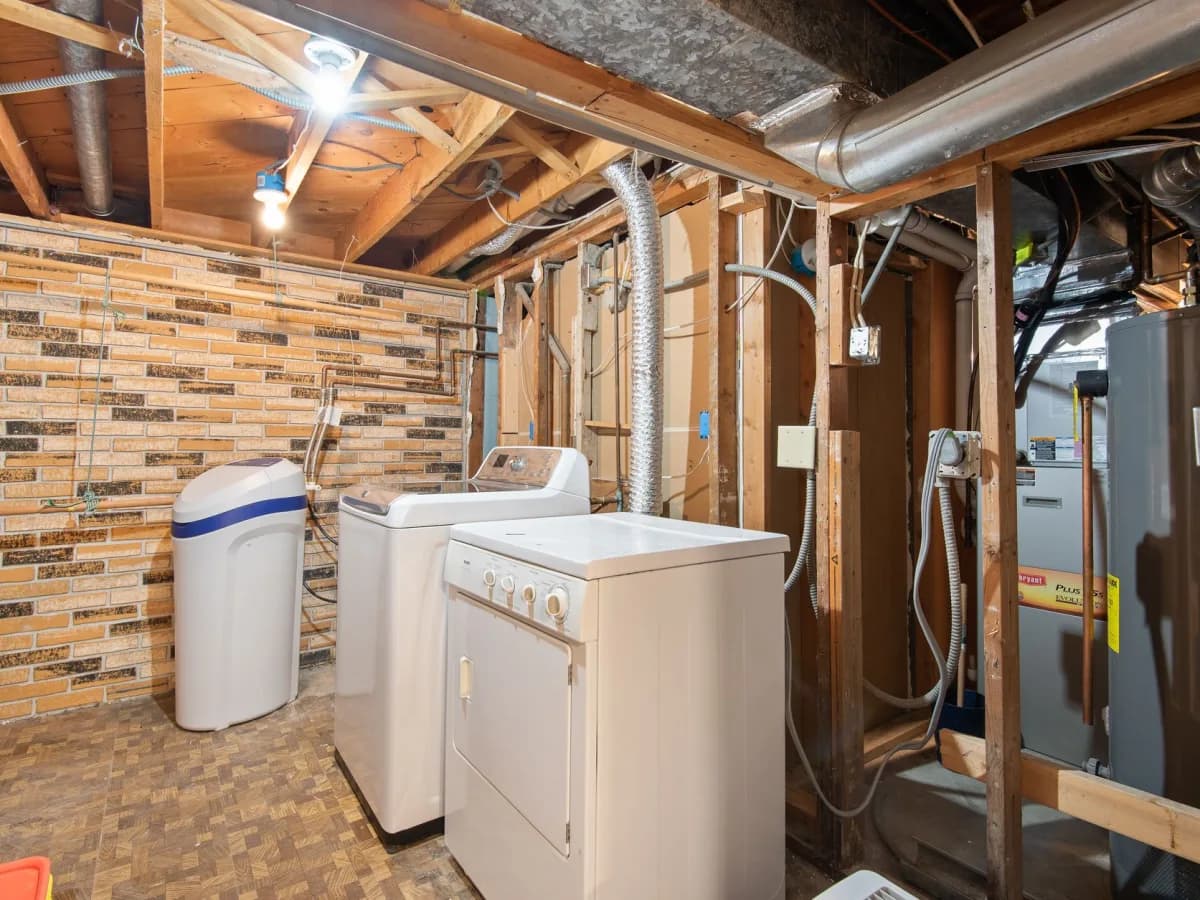Preparing home for humidifier installation by clearing area around the furnace