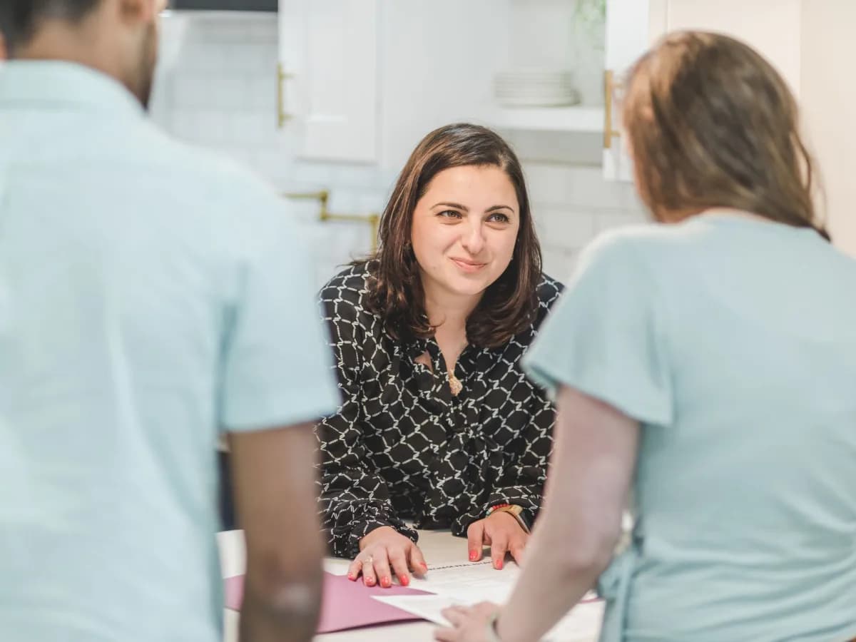Homeowner consultation with technician about humidifier maintenance