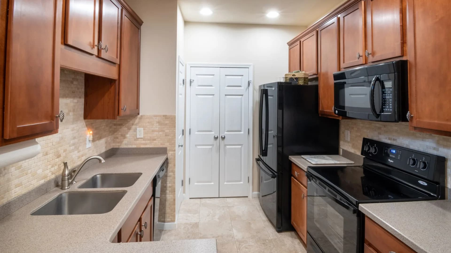 Technician removing dishwasher in a kitchen