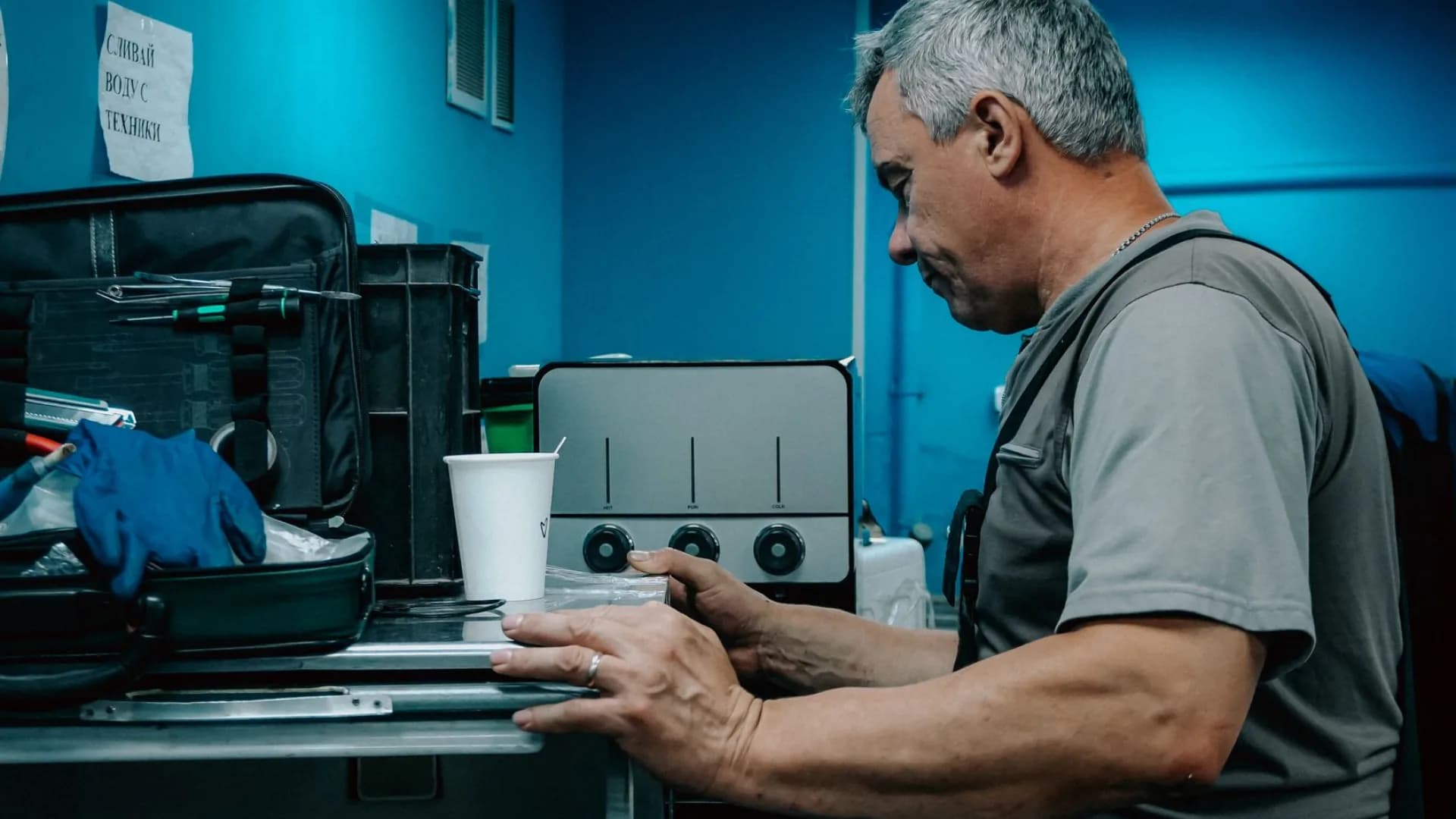 Technician repairing a washing machine in Toronto