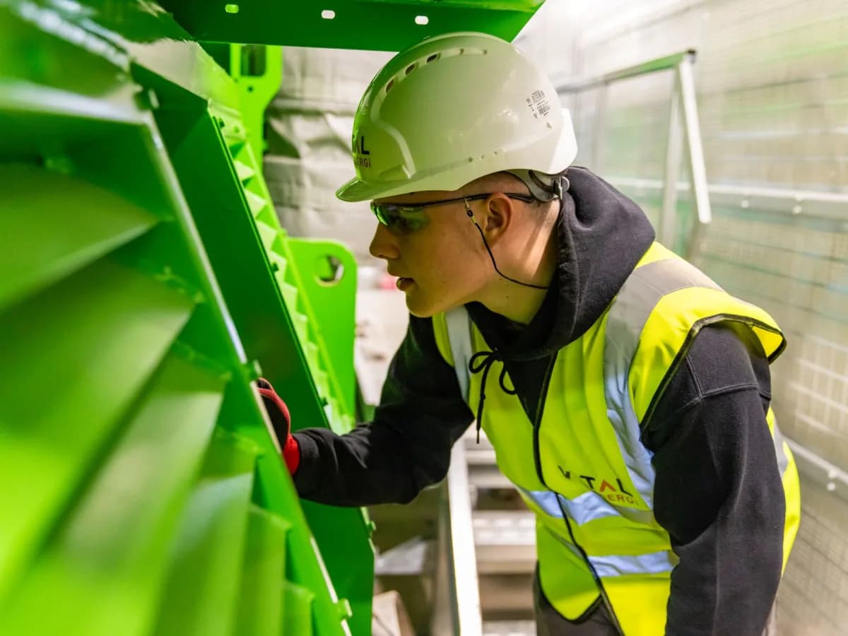 Technician inspecting washing machine