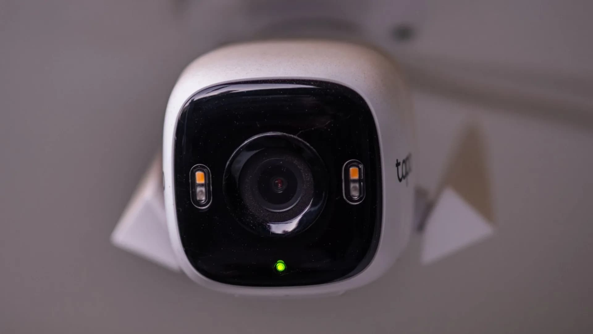 Homeowner installing a security camera