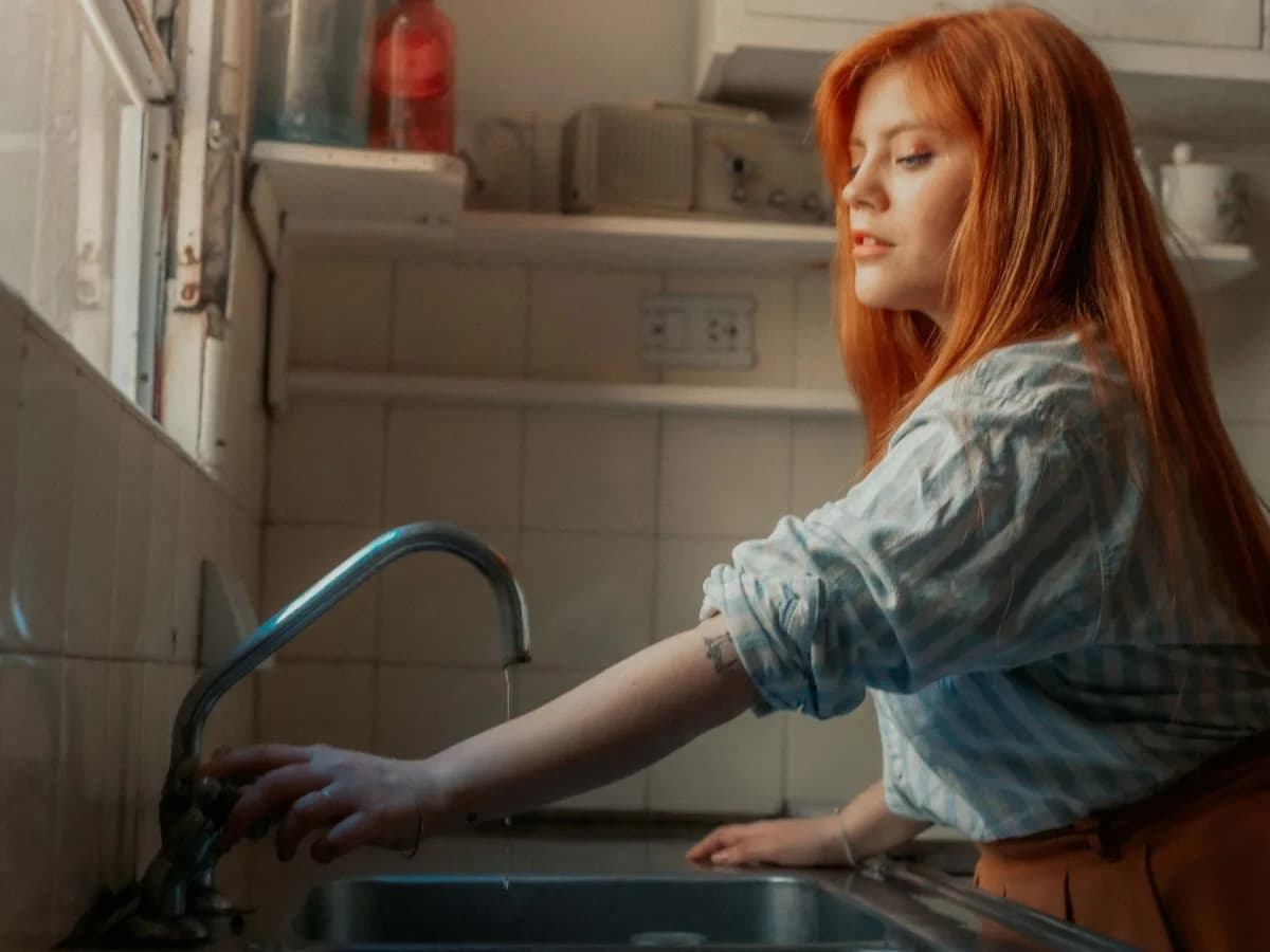 Checking seals around kitchen sink