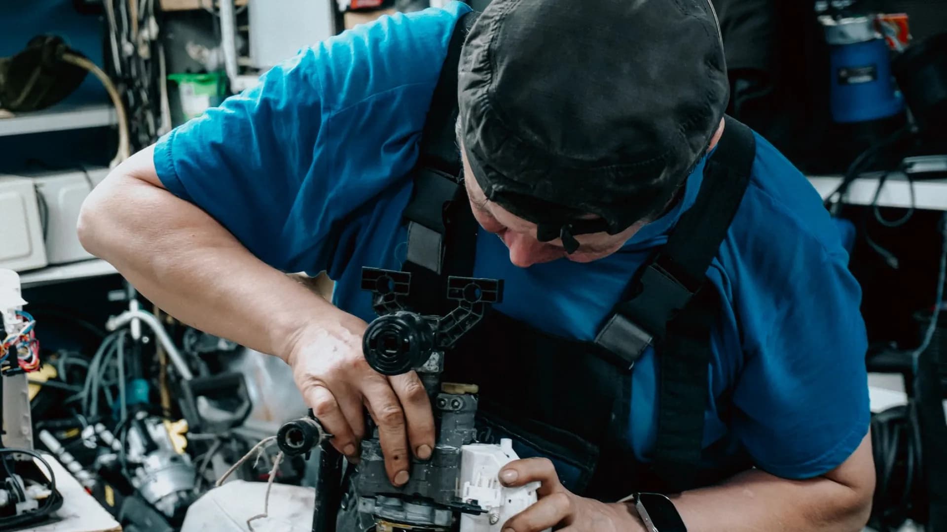 Professional repairing a kitchen sink during renovations