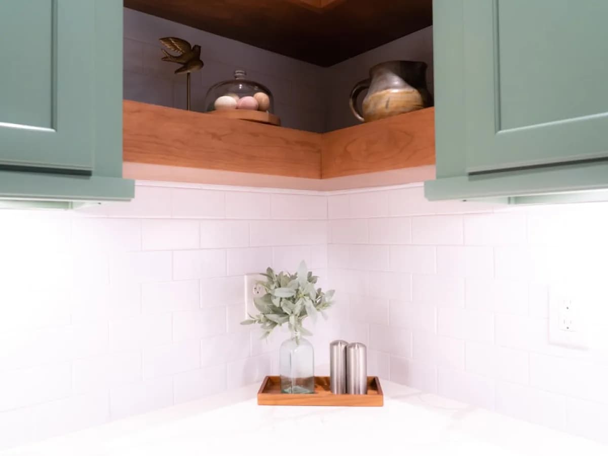 Worker repairing kitchen cabinet door