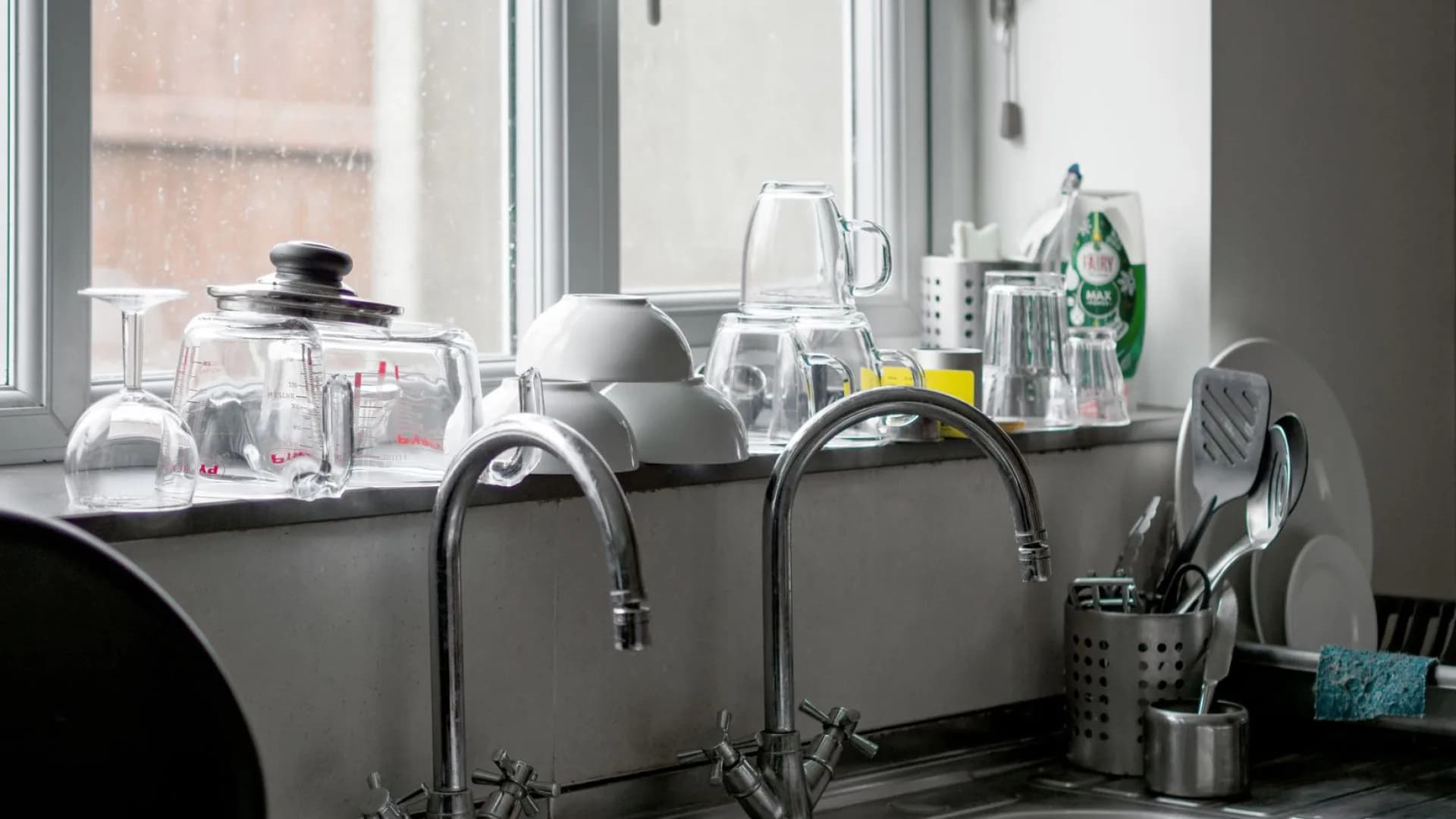 Technician repairing kitchen faucet
