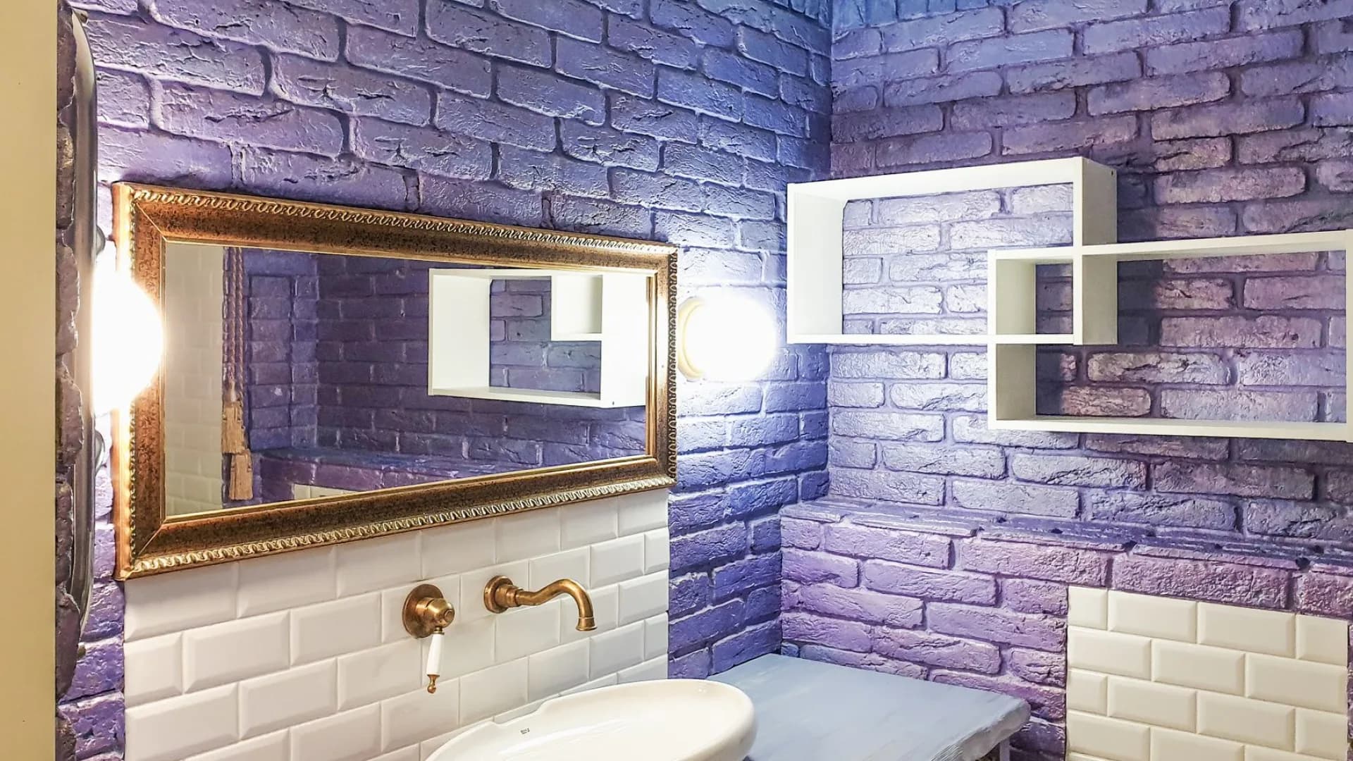 Installer leveling and securing a wall-mounted bathroom vanity.