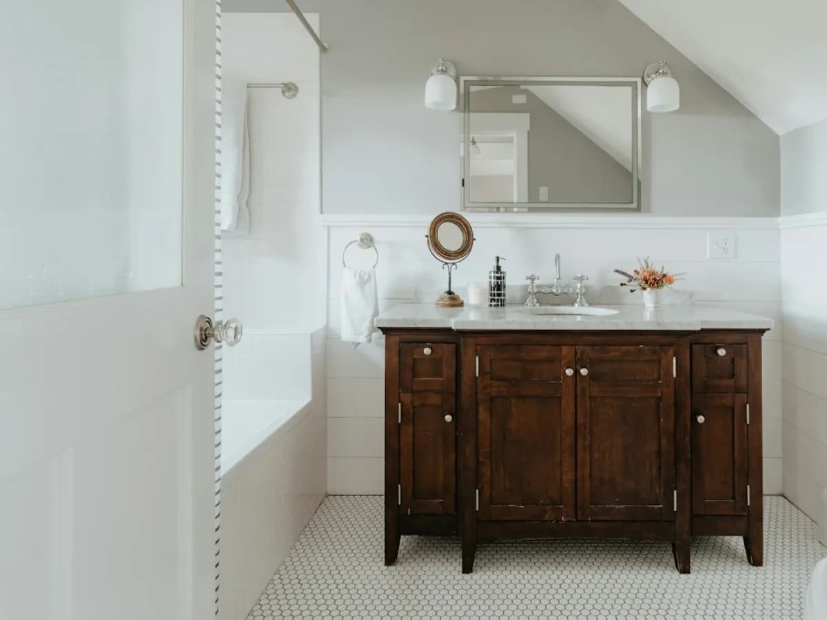 Cleared bathroom vanity cabinet with floor protection ready for replacement