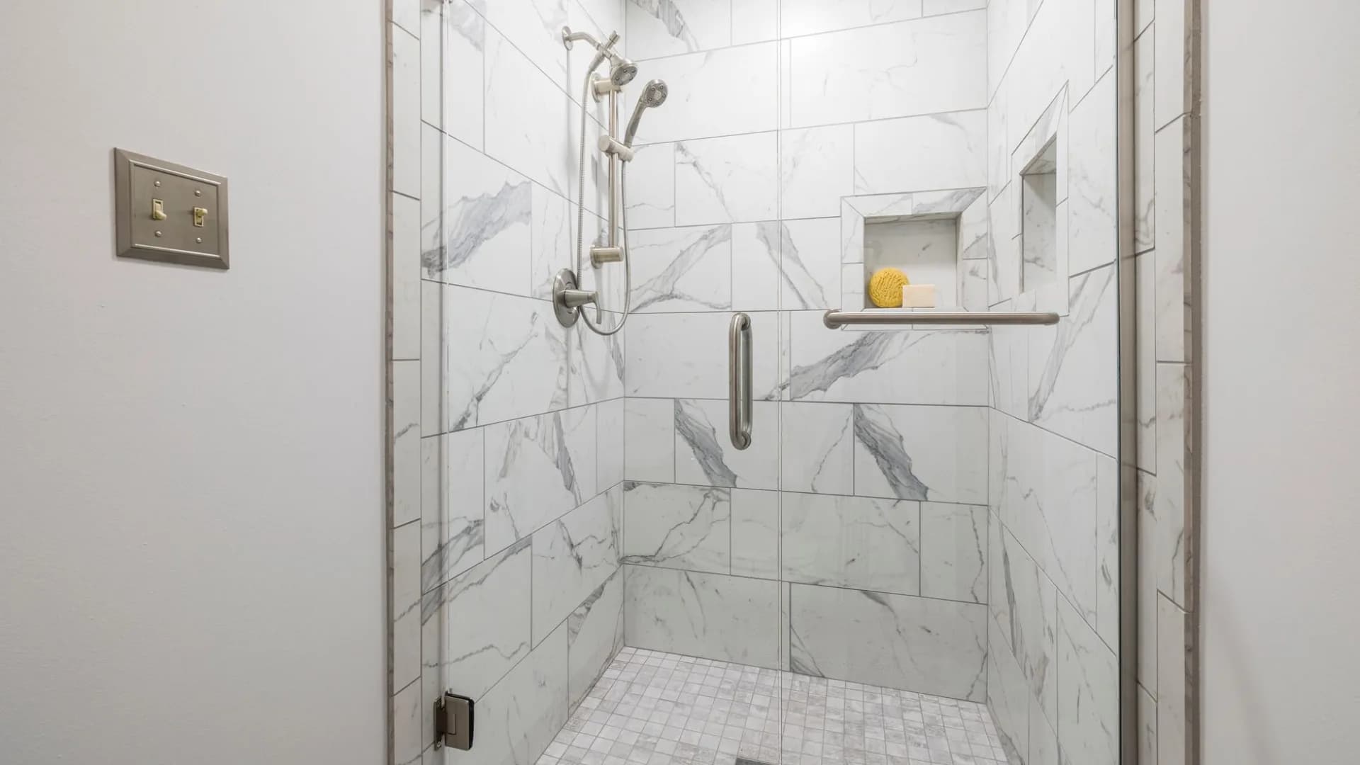 Professional installing shower door in bathroom