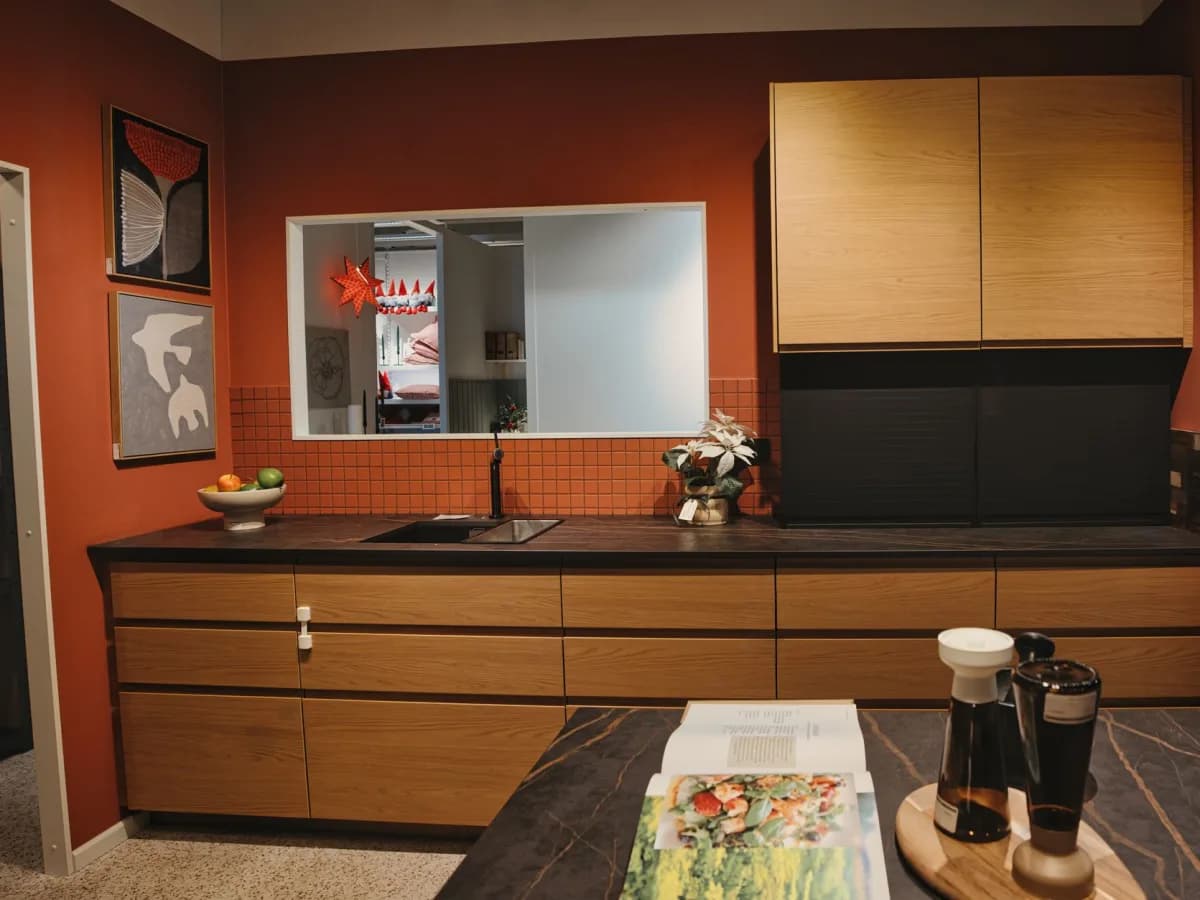 Aligned kitchen cabinets with matching black pulls after hardware installation