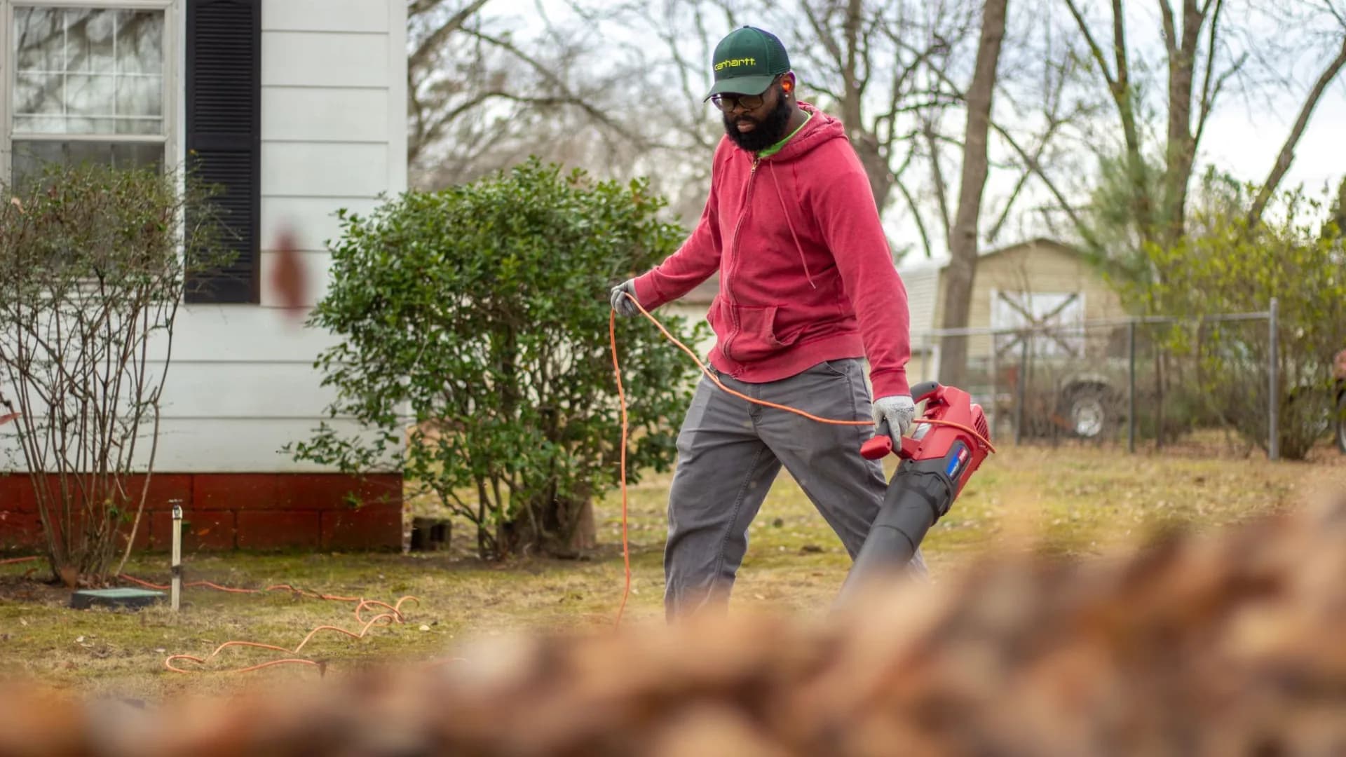 Leaf removal service in action during autumn.