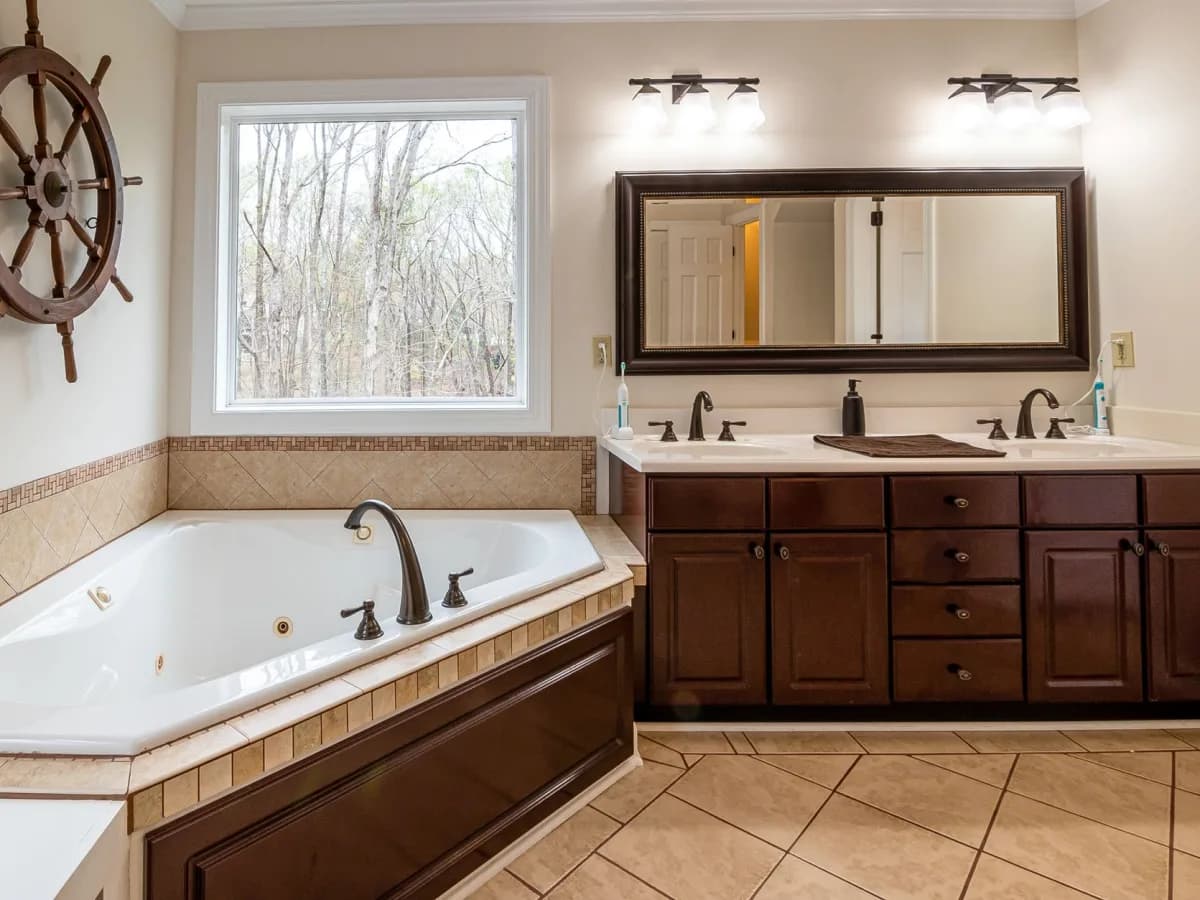Water staining and a small leak inside a bathroom vanity cabinet