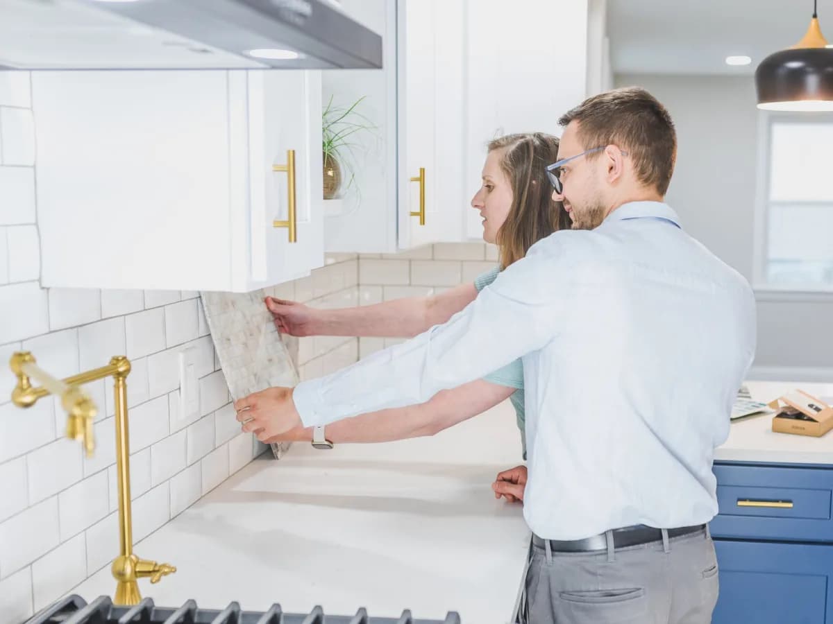 Renovation plans laid out on a kitchen countertop